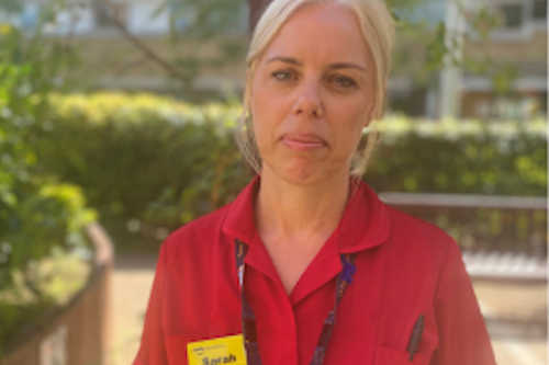 Chief Nurse Sarah Wilding wearing red uniform Chief Nurse Sarah Wilding wearing red uniform